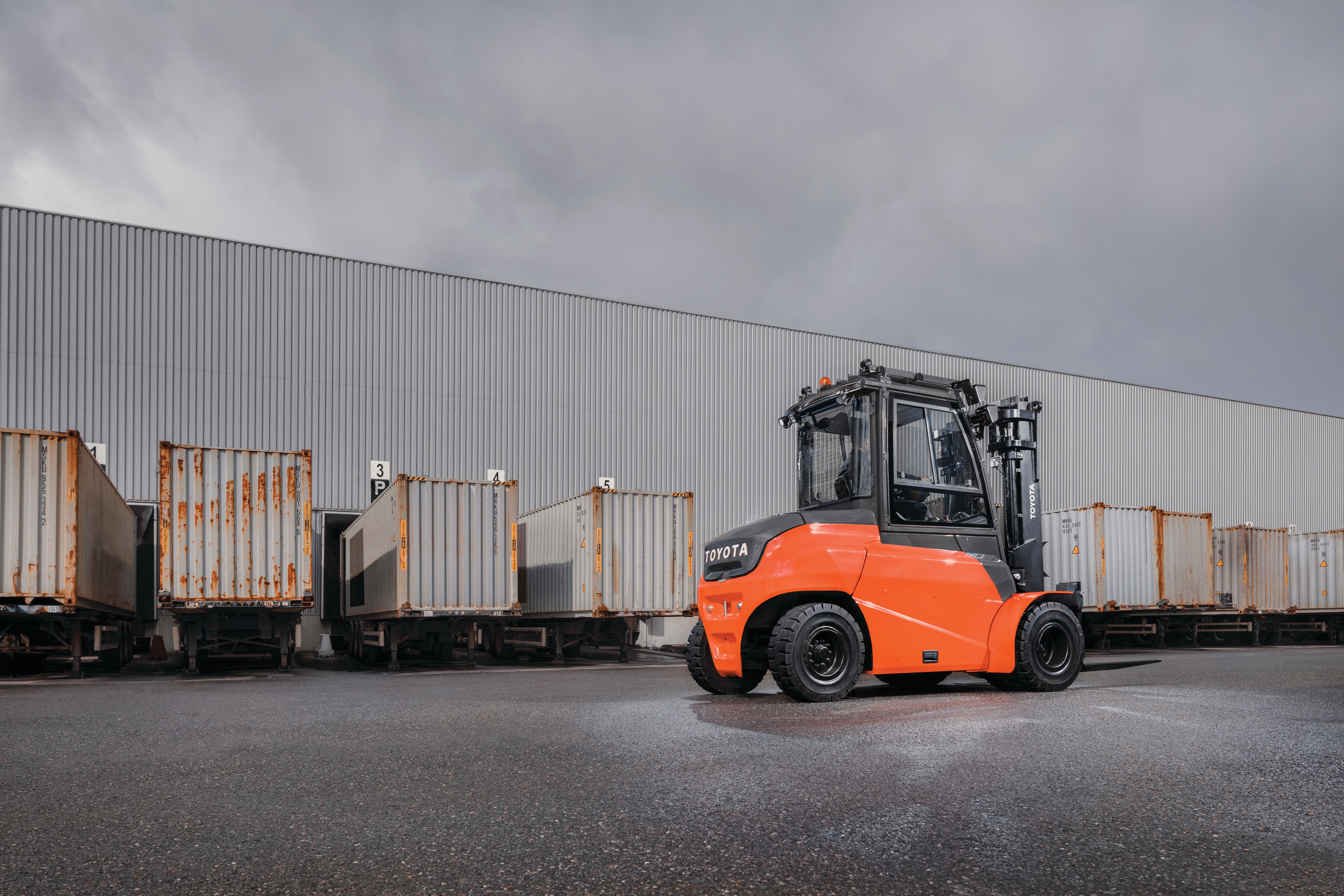 Williams Intuitive Marketing provides marketing and social media management services for Toyota forklift dealerships. The photo shows a Toyota Integrated Electric Forklift in front of a large commercial building.